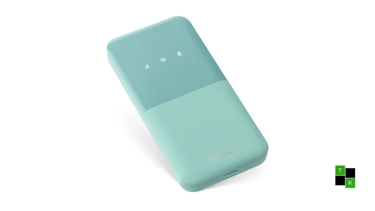 The compact Huawei Mobile WiFi 5 eSIM portable hotspot in cyan resting on a minimalist wooden travel desk.