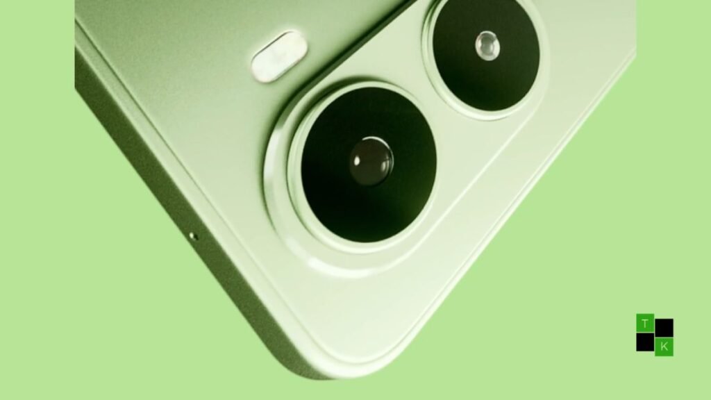 The Mivi One 5G smartphone in a matte Sage Green finish resting on a modern wooden desk beside wireless earbuds.