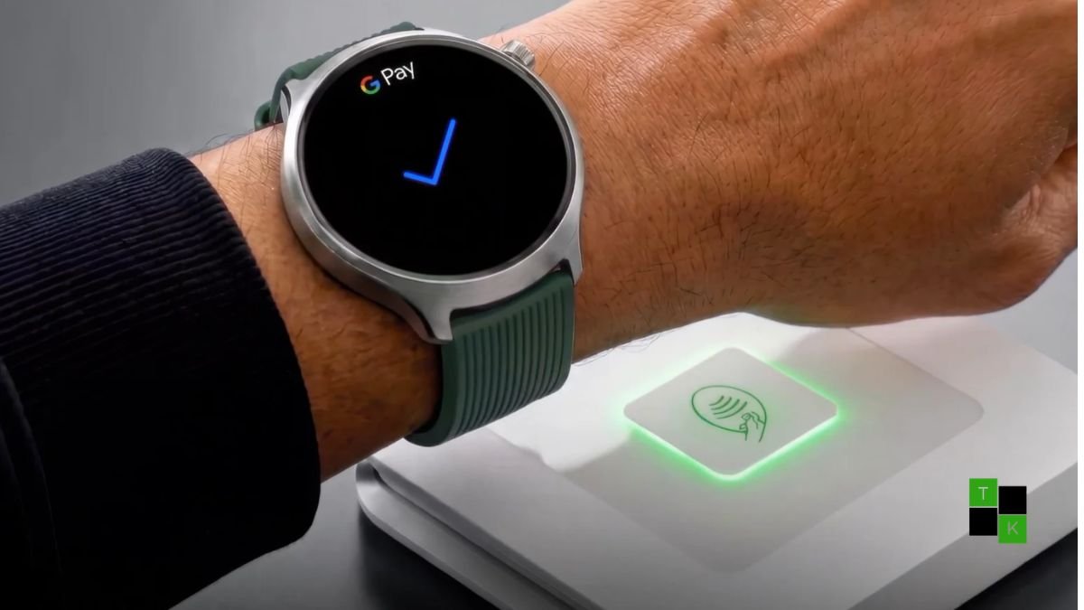 The Motorola Moto Watch Ultra smartwatch in stainless steel with a black silicone strap resting beside a running shoe on a track.