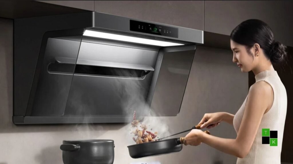 The Xiaomi Mijia Smart Range Hood 3 Max installed above a luxury kitchen countertop showing its sleek glass panel and suction slot.