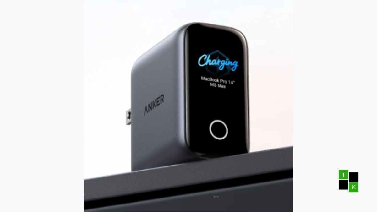 Anker Laptop Charger Pro with illuminated smart display showing device detection and live wattage resting on a laptop.