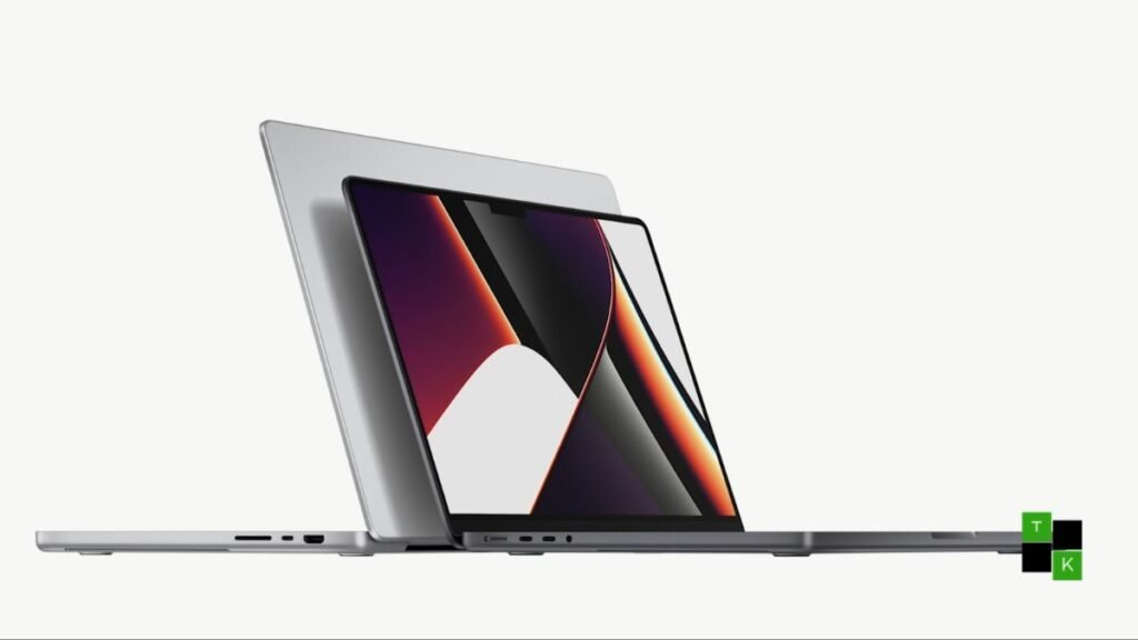 Apple 14-inch Touchscreen MacBook Pro in Space Black showing OLED display, Dynamic Island, and finger tapping an editing timeline.