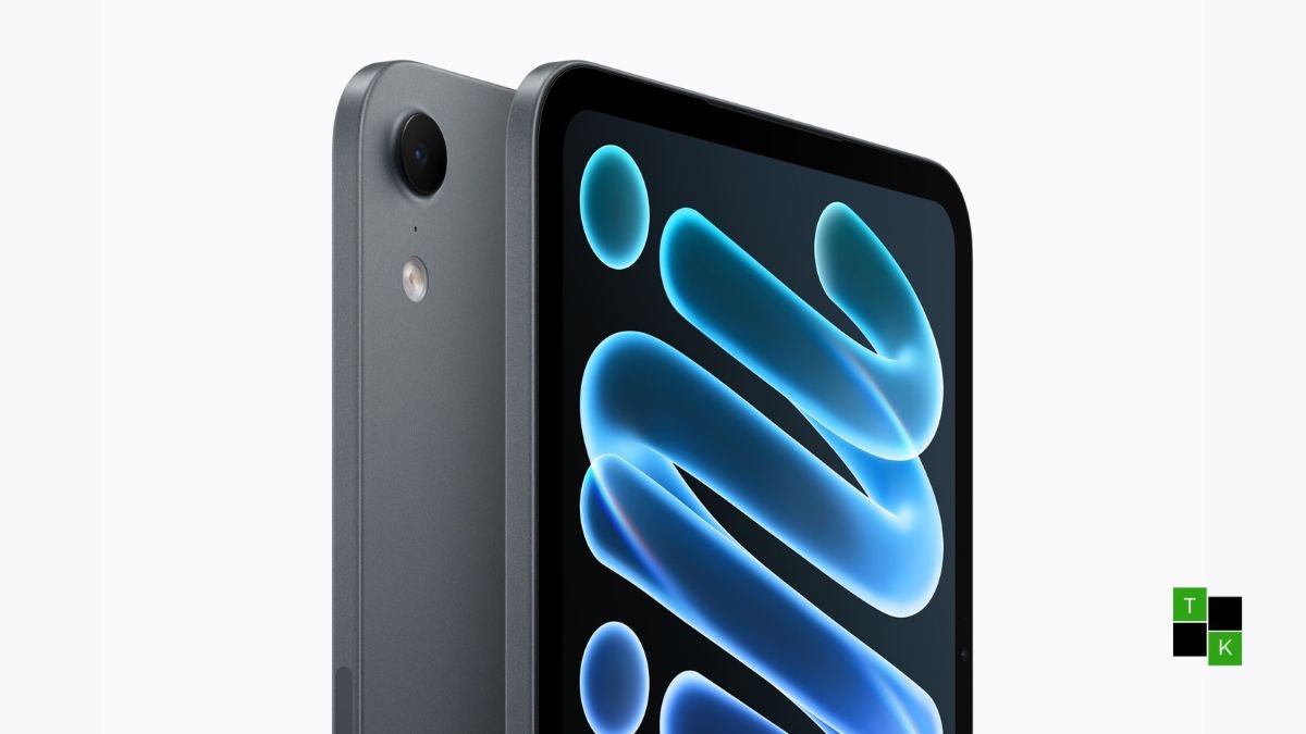 Apple iPad mini 2026 in Starlight finish displaying its 8.5-inch OLED screen with slim bezels and Apple Pencil Pro attached magnetically.