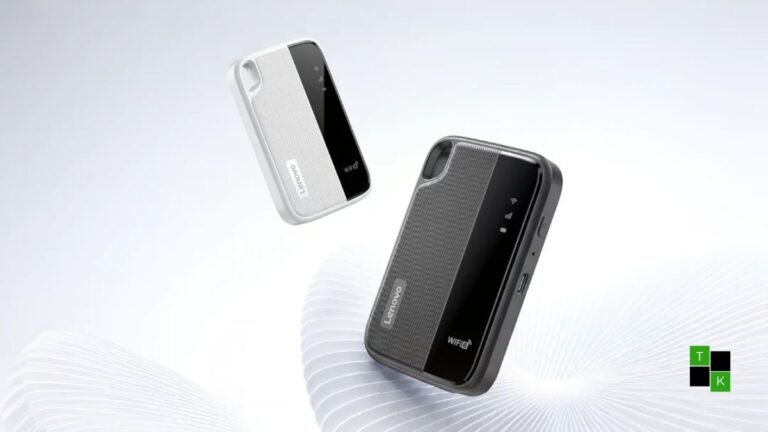 Lenovo Portable Wi-Fi 6+ model L016 pocket hotspot resting on a wooden travel table beside a laptop, displaying subtle LED status indicators.