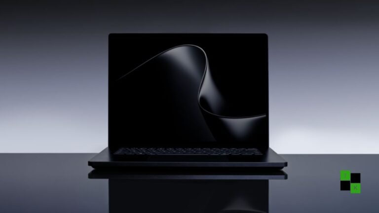 Microsoft Surface Laptop Ultra in Matte Obsidian open on a minimalist creator desk, displaying a vibrant 15-inch Mini-LED screen with local code models active.