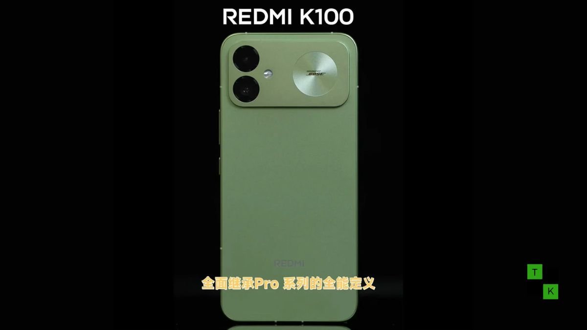 Xiaomi President Lu Weibing holds the Redmi K100 in light green showing its flat rear backplate and dual-camera island.