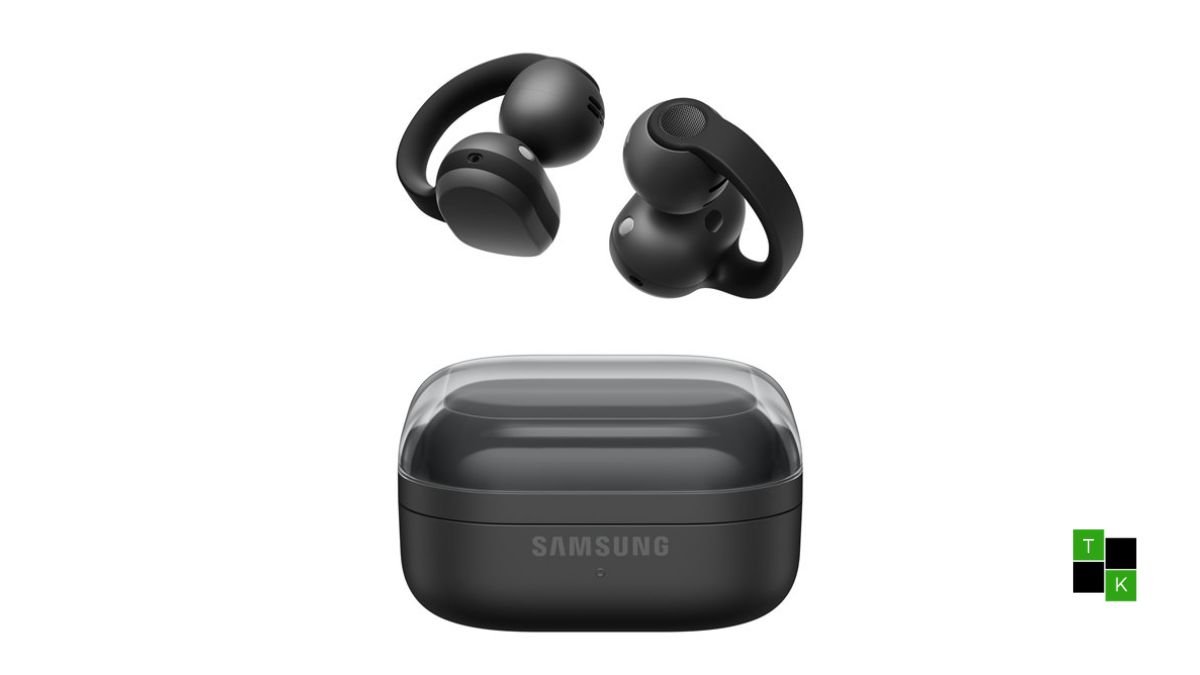 A pair of Samsung Galaxy Buds On clip-style open earbuds in Phantom Black shown resting on a desk next to their pebble charging case.