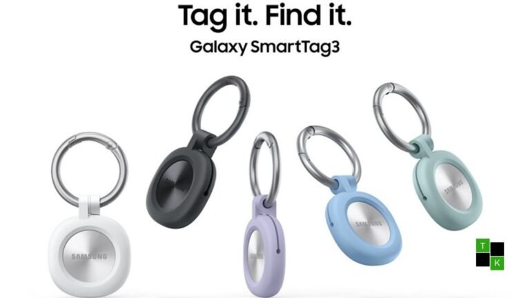 Samsung Galaxy SmartTag 3 circular personal tracker resting in a white silicone loop case on an architectural desk.