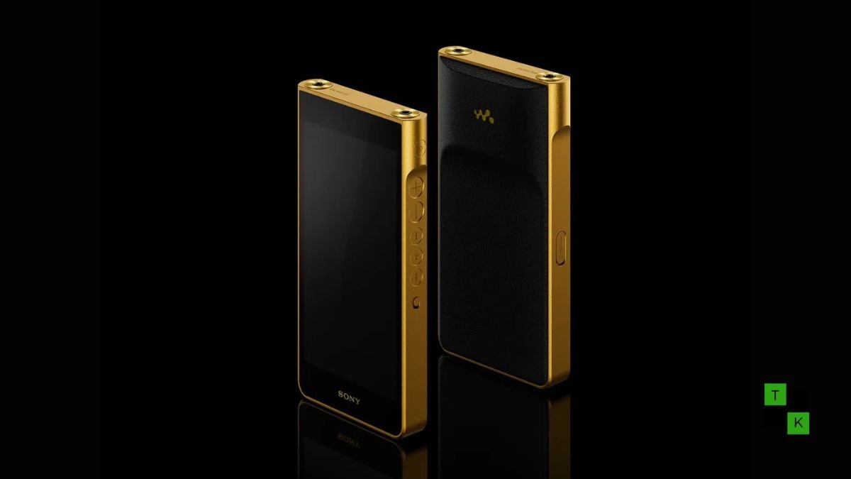 The gold-plated Sony Signature Series NW-WM1ZM3 Walkman resting on an audio engineering desk next to high-end planar magnetic headphones.